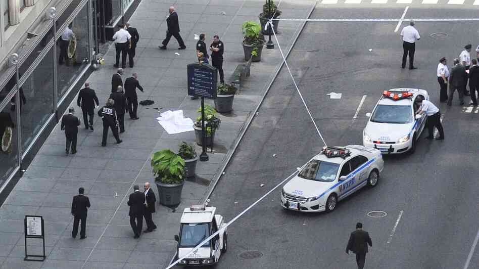 Police investigate a shooting at the Empire State Building in New York on Friday.