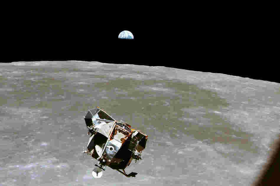 With a half-Earth in the background, the lunar module, in its ascent stage with moon-walking Armstrong and Aldrin, approaches for a rendezvous with the Apollo command module, manned by Collins.