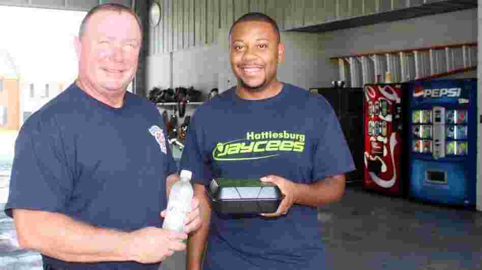 Capt. Michael Davidson of the Hattiesburg Fire Dept. and Jaycee Marquise Slator.