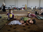 Syrian children, who fled their home with their family, take refuge at the Bab Al-Salameh border crossing, in hopes of entering one of the refugee camps in Turkey on Sunday. Syrian children, who fled their home with their family, take refuge at the Bab Al-Salameh border crossing, in hopes of entering one of the refugee camps in Turkey on Sunday.