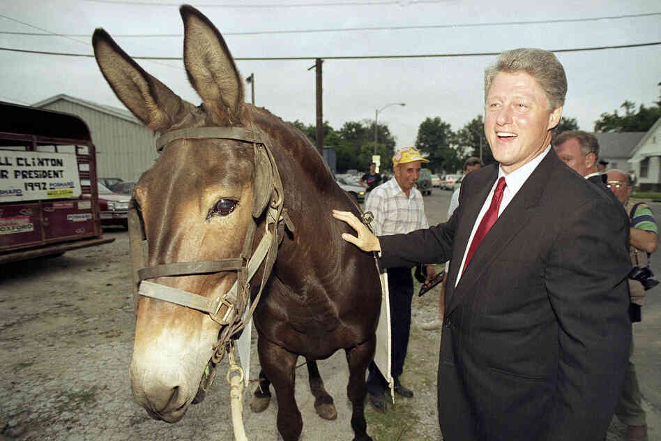 Democratic presidential candidate Bill Clinton poses with a mule during a campaign stop in Centralia, Ill., in 1992.