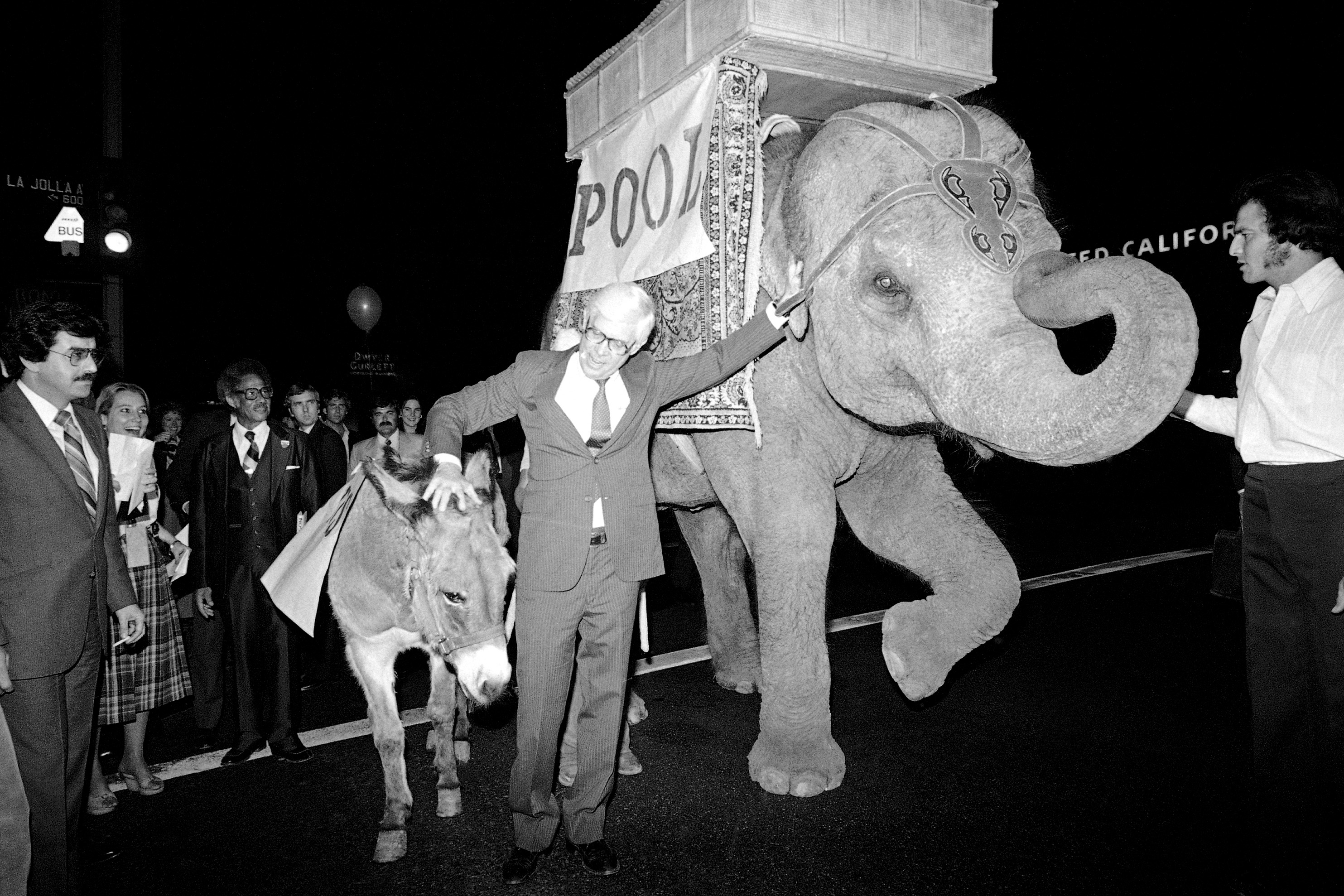 John Anderson (center), who made an independent bid for president in 1980, takes measure of a donkey and an elephant outside his campaign headquarters in Los Angeles. Campaign aides, poking fun at reporters covering Anderson, indicated that the elephant would serve as the media bus and the donkey the media car in the Los Angeles area.