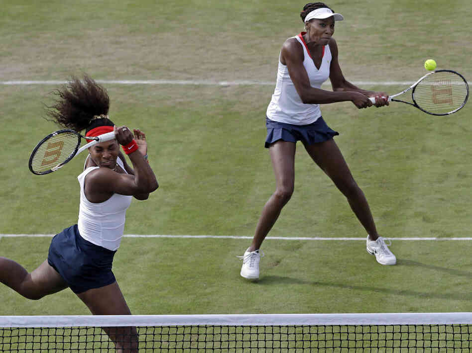 Serena Williams, left, and Venus Williams compete in Wimbledon at the 2012 Summer Olympics.