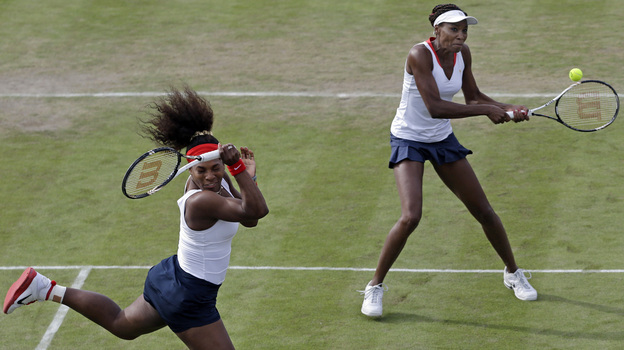 Serena Williams, left, and Venus Williams compete in Wimbledon at the 2012 Summer Olympics. (AP)