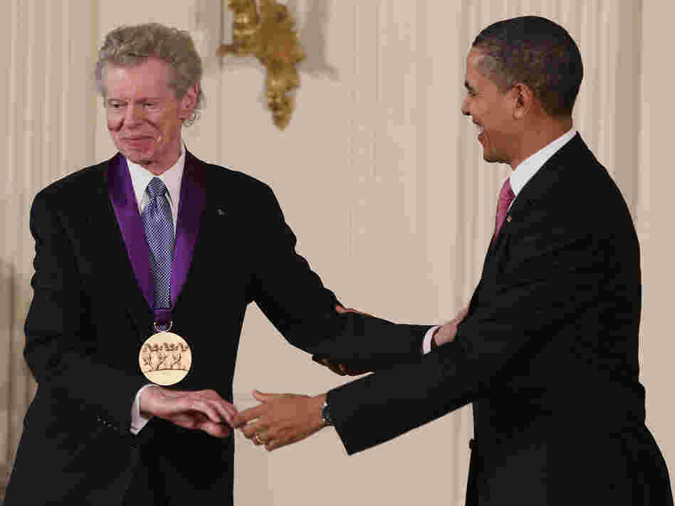 President Obama congratulates pianist Van Cliburn after presenting him with the National Medal of Arts in 2011.
