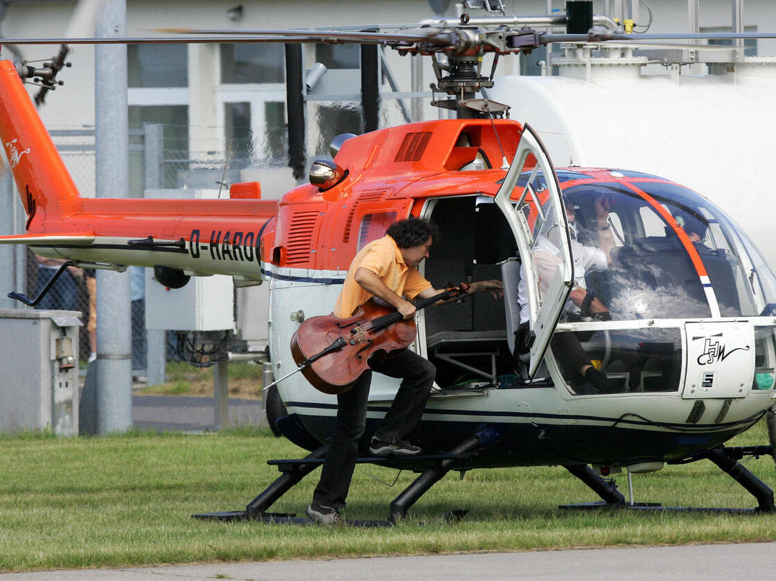 Cellist Karl Huros alights a helicopter for his 2007 performance in Stockhausen's Helicopter Quartet, taken from his opera cycle Light.