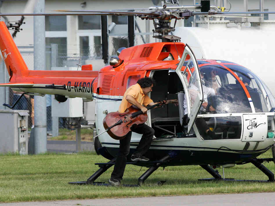 Cellist Karl Huros alights a helicopter for his 2007 performance in Stockhausen's Helicopter Quartet, taken from his opera cycle Light.