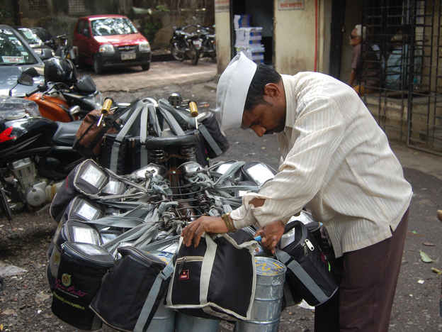 A dabba wallah checks his packages before delivering hot meals to office workers in Mumbai.
