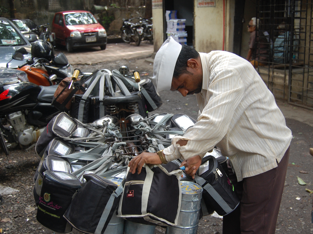 A dabba wallah checks his packages before delivering hot meals to office workers in Mumbai.