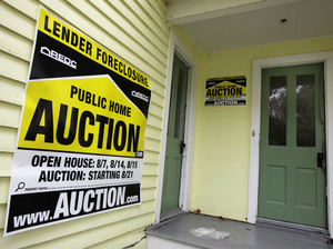 A home has a foreclosure auction sign displayed in Chagrin Falls, Ohio, in September 2010. A home has a foreclosure auction sign displayed in Chagrin Falls, Ohio, in September 2010.