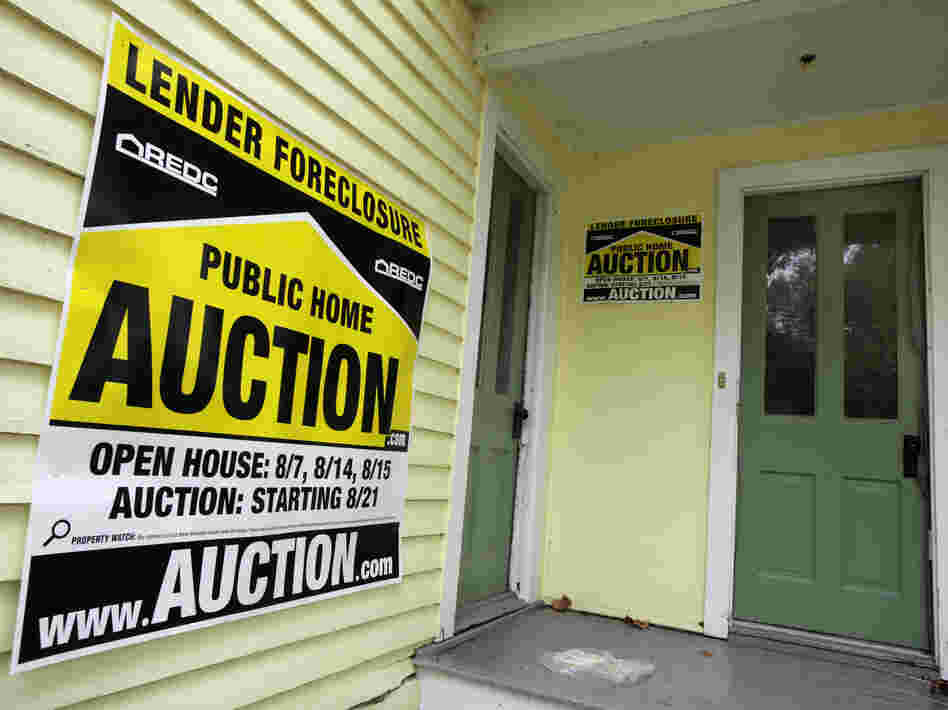 A home has a foreclosure auction sign displayed in Chagrin Falls, Ohio, in September 2010.