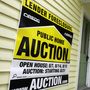 A home has a foreclosure auction sign displayed in Chagrin Falls, Ohio, in September 2010.