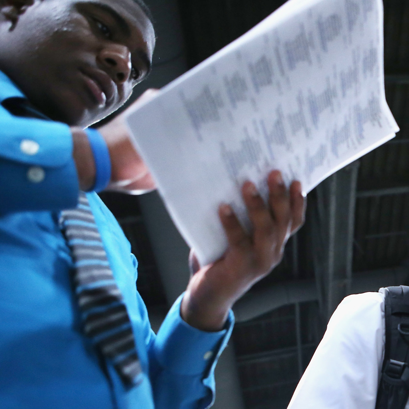 Young job-seekers look over a list of 85 business participating in a job fair last week in Washington, D.C.