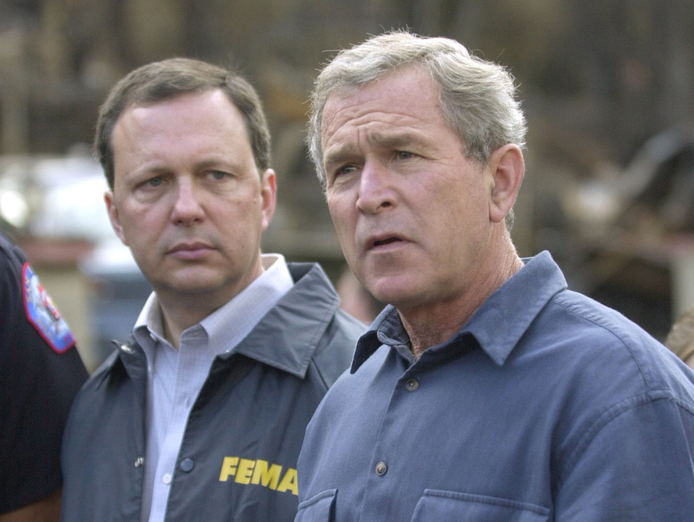 FEMA's Michael Brown (left) and President George W. Bush, seen in 2003, were widely criticized for their response after Hurricane Katrina devastated the Gulf Coast in 2005.