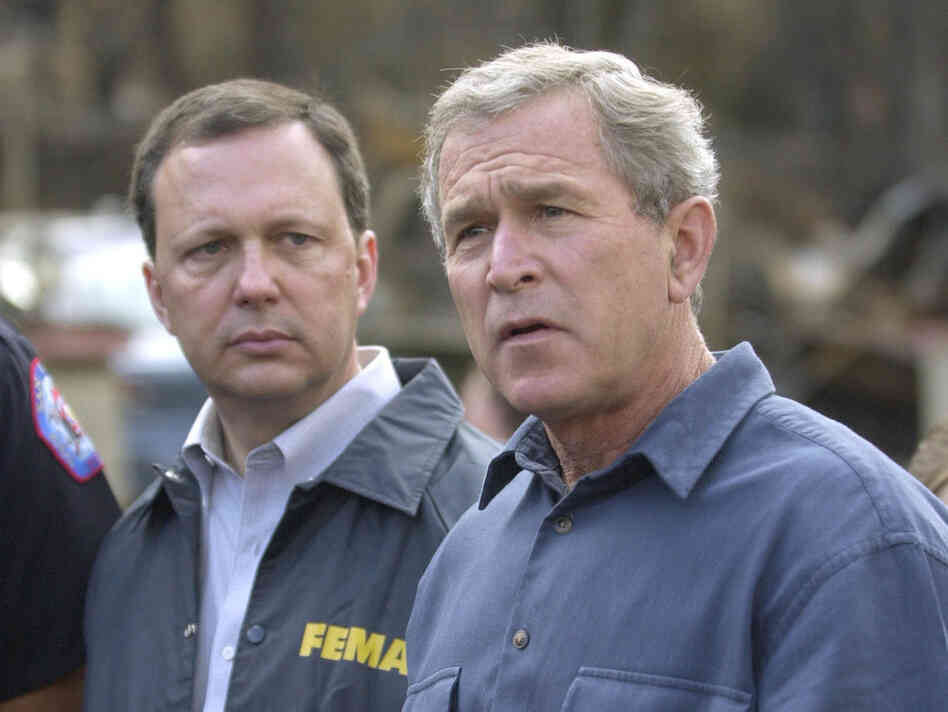 FEMA's Michael Brown (left) and President George W. Bush, seen in 2003, were widely criticized for their response after Hurricane Katrina devastated the Gulf Coast in 2005.