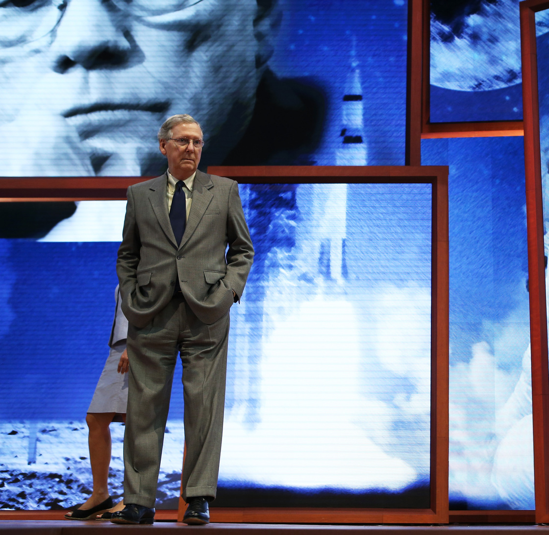 Sen. Minority Leader Mitch McConnell, R-Ky., checked out the Republican Convention stage in Tampa on Sunday. The backdrop is in honor of Apollo 11 astronaut Neil Armstrong, the first man to walk on the moon, who died over the weekend.