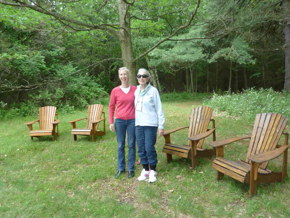 Augsbury (right) stands with her daughter, Abby Howard-Smith Rand, next to the chairs she relaxes in, just feet away from the gravesites of two husbands.