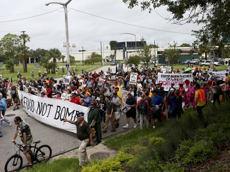 Turnout for Monday's protest rally and march in downtown Tampa was much lower than expected and rain drenched the crowd. Turnout for Monday's protest rally and march in downtown Tampa was much lower than expected and rain drenched the crowd.