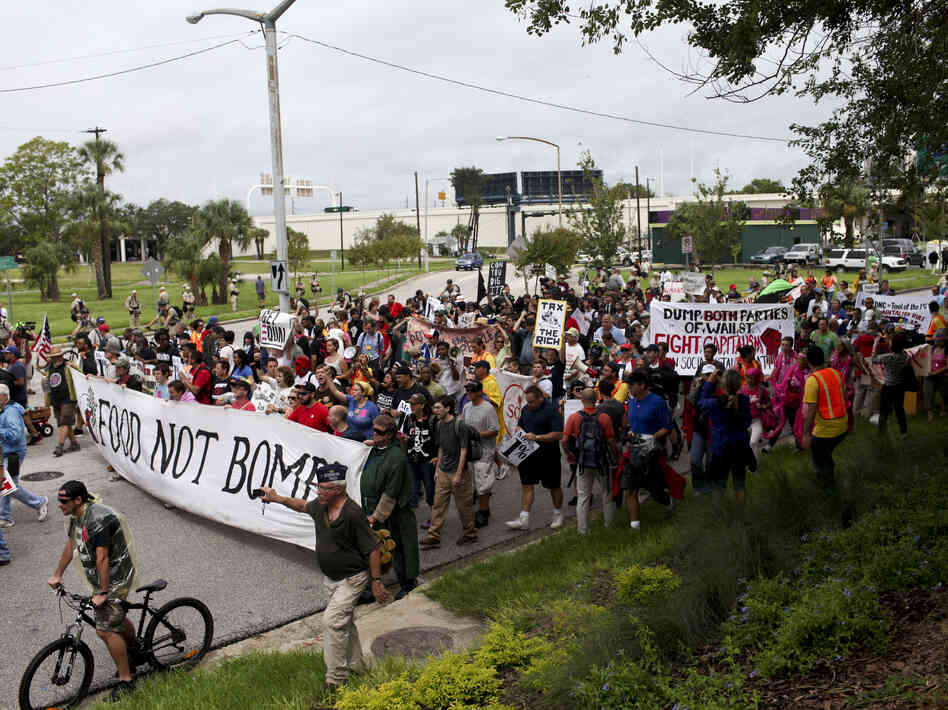 Turnout for Monday's protest rally and march in downtown Tampa was much lower than expected and rain drenched the crowd.