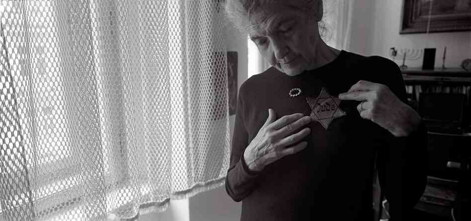 Andula Lorencova, born in 1927, in her apartment with her original yellow star, Prague, June 2012. While her father was "trying to procure official Chinese approval for his family to join him, Andula along with her brother and mother were deported to Terezin."