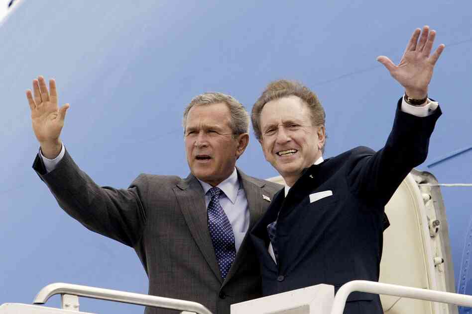 Specter campaigns with President George W. Bush in 2004 at the Harrisburg International Airport in Pennsylvania. Specter spent most of his political career as a moderate Republican. He supported Bush, but later criticized the then-president's warrantless wiretapping program, saying it overstepped civil liberties.