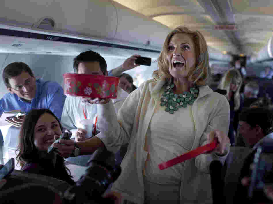 Ann Romney, wife of Republican presidential candidate Mitt Romney, shares her homemade Welsh cakes with reporters on the flight to Tampa on Tuesday.