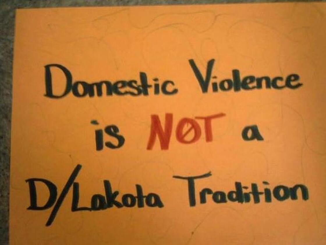 A handmade poster at Wiconi Wawokiya.