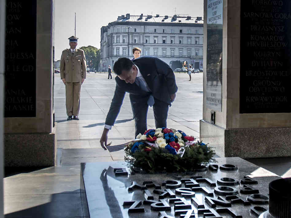 Republican presidential candidate, former Massachusetts Governor Mitt Romney, lays a wreath at the Tomb of the Unknown Soldier on July 31, 2012 in Warsaw, Poland.