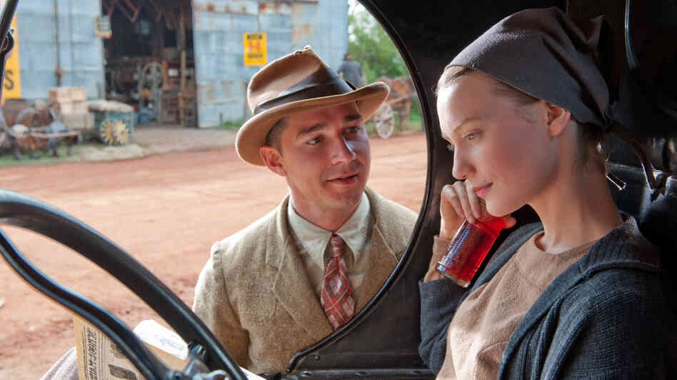 Jack Bondurant (Shia LeBeouf) finds escape from the brutality of his family's bootlegging business in the company of the radiant Bertha (Mia Wasikowska). Jack Bondurant (Shia LeBeouf) finds escape from the brutality of his family's bootlegging business in the company of the radiant Bertha (Mia Wasikowska).