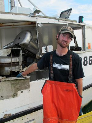 Commercial fishermen Sam Fuller next to the gillnetting boat he works on, the Lori B. Commercial fishermen Sam Fuller next to the gillnetting boat he works on, the Lori B.