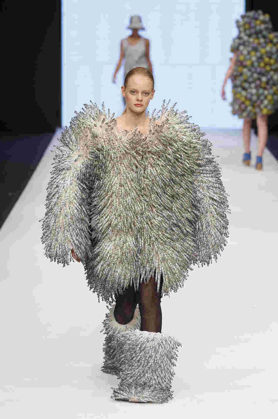 A model walks down the runway during the Maria Sofia Bahlner S/S 2013 Fashion Show from the Swedish School of Textiles during the Mercedes-Benz Stockholm Fashion Week.