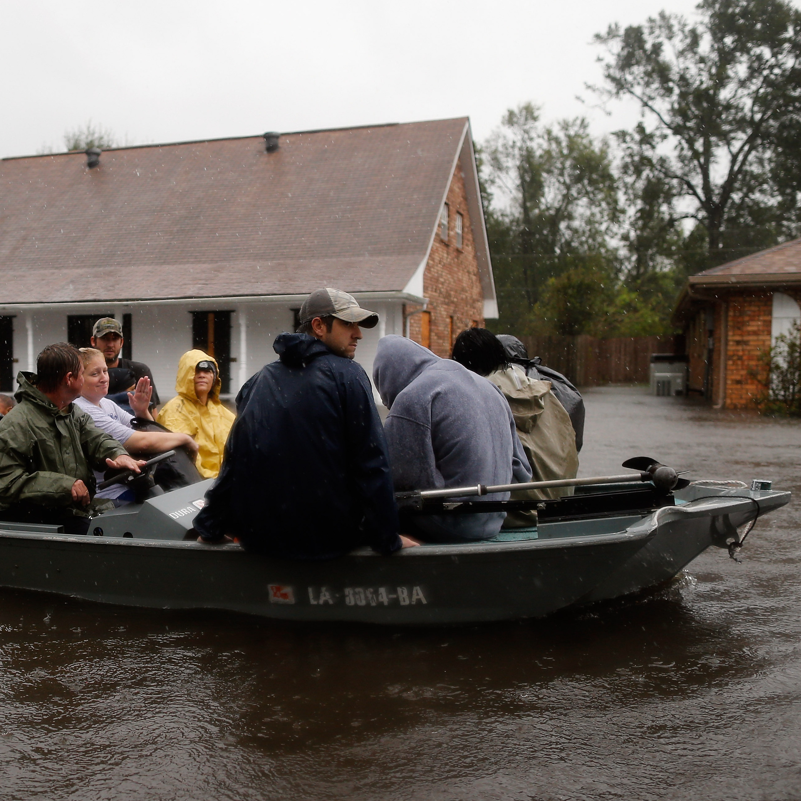 Rescue workers transport residents trapped by rising water from Hurricane Isaac in the River Forest subdivision on Wednesday in LaPlace, Louisiana. The large Level 1 hurricane slowly moved across southeast La., dumping huge amounts of rain and knocking out power across the Gulf Coast.