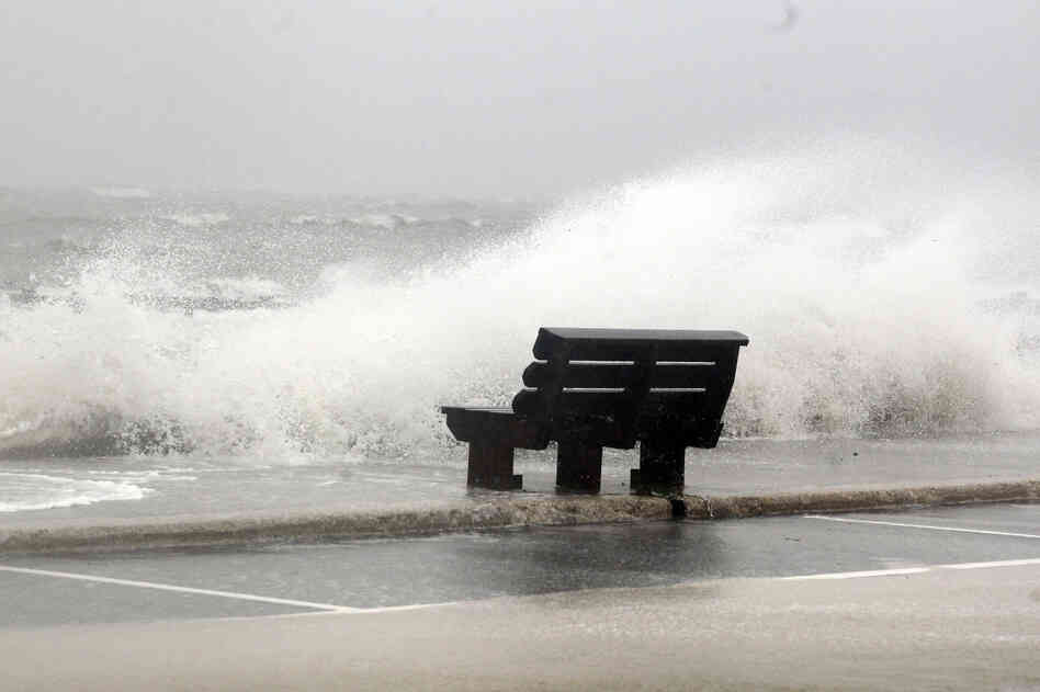 Waves from Hurricane Isaac batter a pier in Gulfport, Miss.