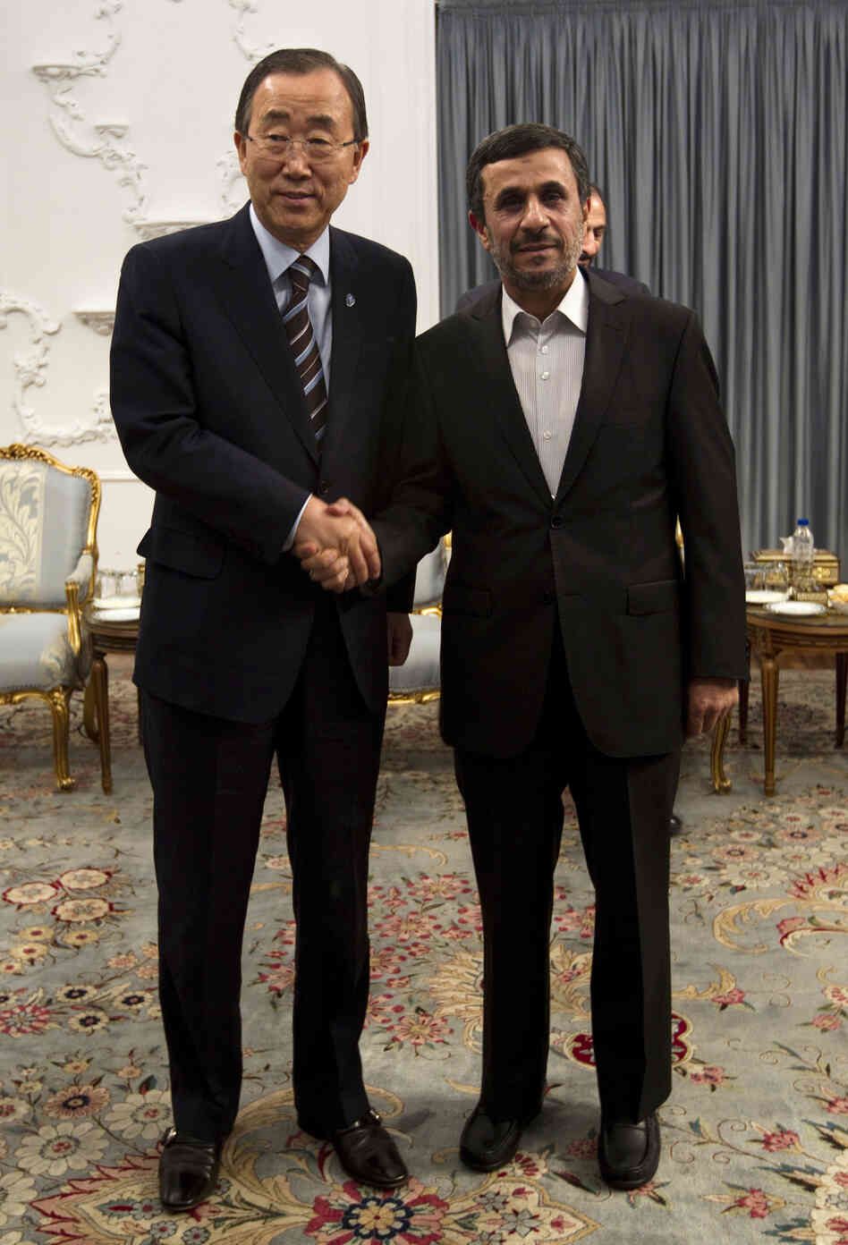 U.N. Secretary-General Ban Ki-moon (left) and Iranian President Mahmoud Ahmadinejad hold talks at the Iranian president's office in Tehran on Wednesday.