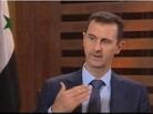 Screen grab from Syrian President Bashar Assad's televised interview. Screen grab from Syrian President Bashar Assad's televised interview.