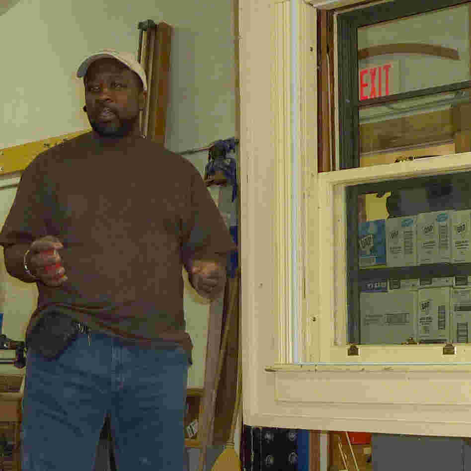 Pernell Jackson teaches a workshop on how to install storm windows.