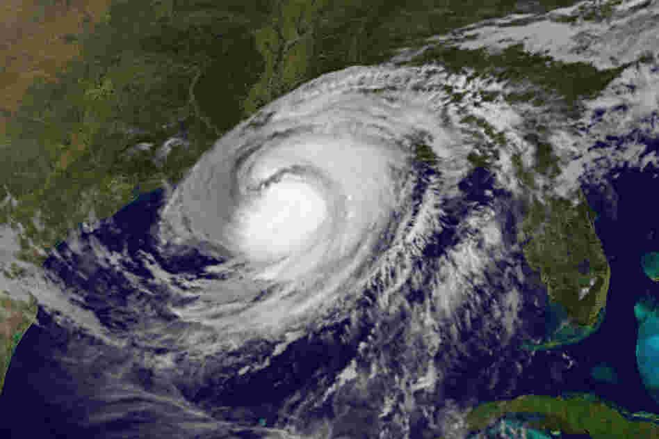 This satellite image shows Hurricane Isaac over the Gulf of Mexico and the Gulf states Wednesday. Rising waters spilled over a levee south of New Orleans and inundated a residential area that had been ordered evacuated.