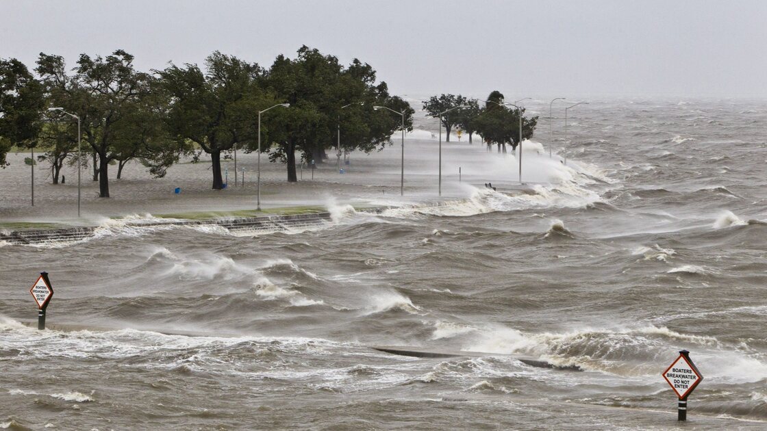 A storm surge causes tides to quickly rise while rough waves pound the concrete seawall along the shores of Lake Pontchartrain. Hurricane Isaac made landfall along the Gulf Coast and now threatens New Orleans.