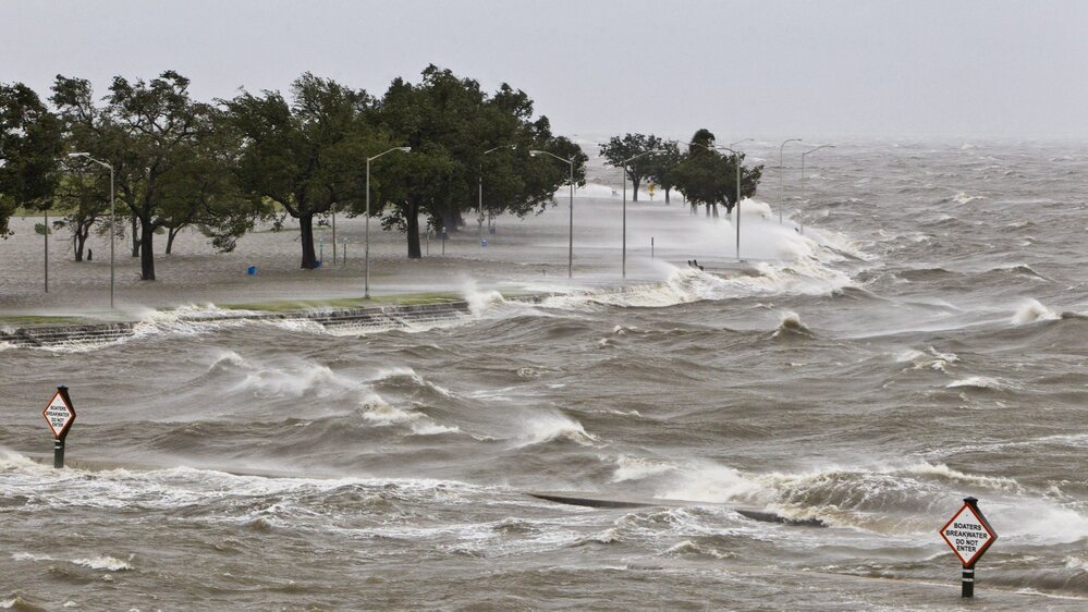 A storm surge causes tides to quickly rise while rough waves pound the concrete seawall along the shores of Lake Pontchartrain. Hurricane Isaac made landfall along the Gulf Coast and now threatens New Orleans.