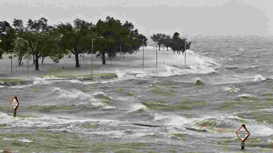 A storm surge causes tides to quickly rise while rough waves pound the concrete seawall along the shores of Lake Pontchartrain. Hurricane Isaac made landfall along the Gulf Coast and now threatens New Orleans.