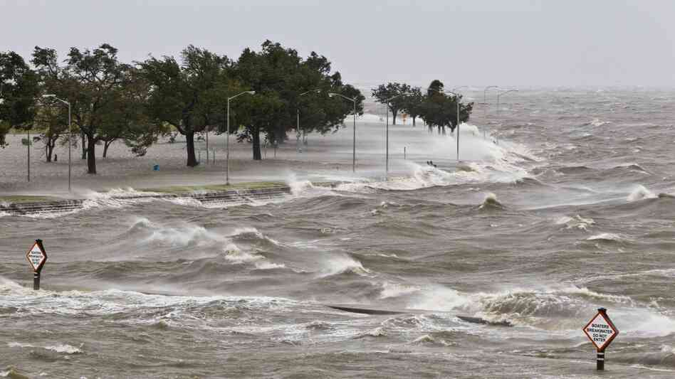 A storm surge causes tides to quickly rise while rough waves pound the concrete seawall along the shores of Lake Pontchartrain. Hurricane Isaac made landfall along the Gulf Coast and now threatens New Orleans.