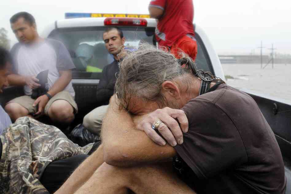 Residents who were rescued from their flooded homes are transported to waiting assistance, after Hurricane Isaac made landfall and flooded homes with 10 feet of water in Braithwaite, La. Isaac was downgraded to a tropical storm Wednesday afternoon.