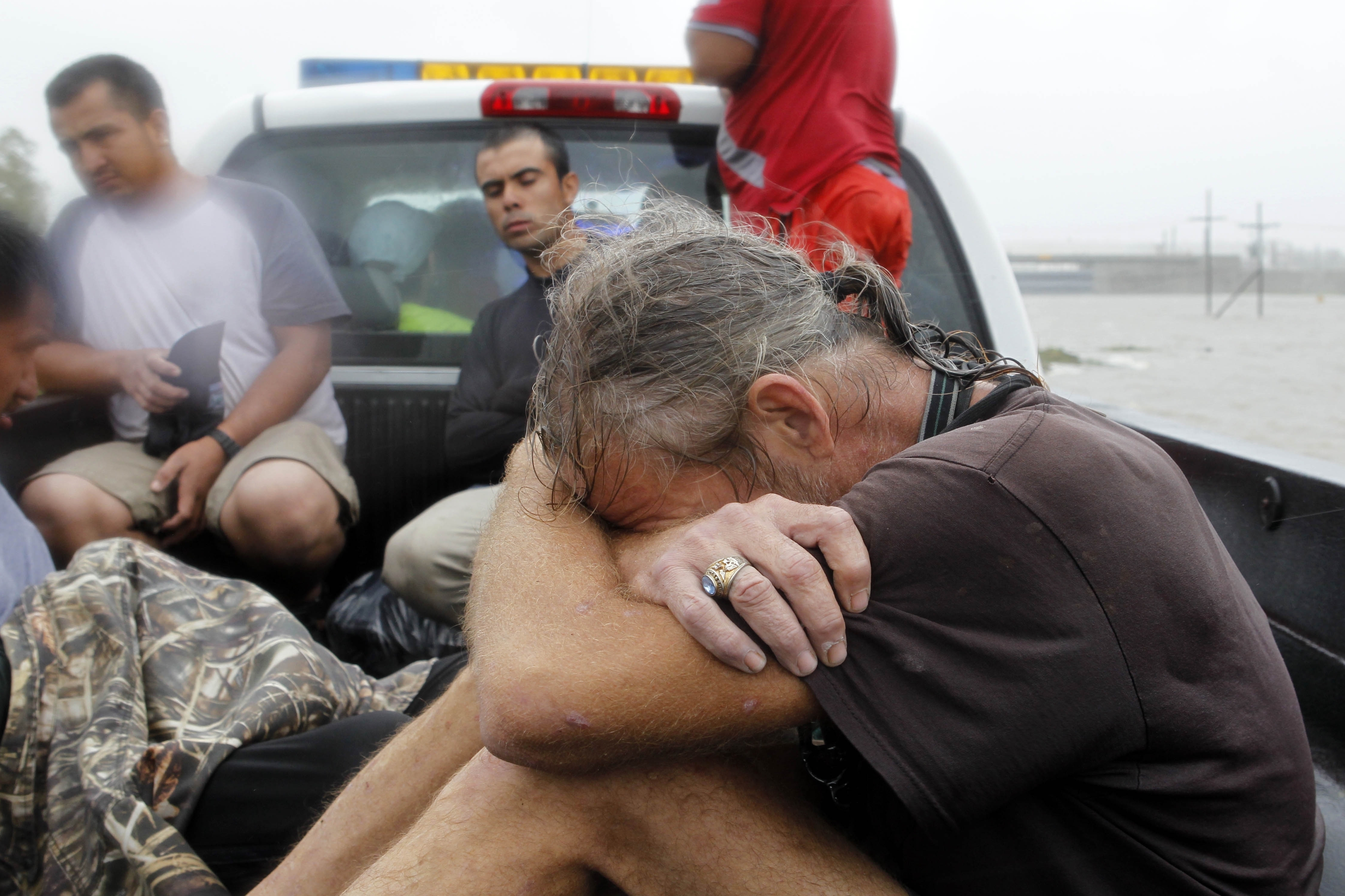 Residents who were rescued from their flooded homes are transported to waiting assistance, after Hurricane Isaac made landfall and flooded homes with 10 feet of water in Braithwaite, La. Isaac was downgraded to a tropical storm Wednesday afternoon.