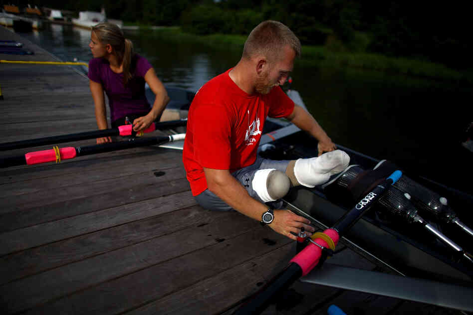 U.S. rowers Rob Jones and Oksana Masters train at the Rivanna Reservoir in Charlottesville, Va. The pair will compete in adaptive rowing at the London Paralympics this week. Jones, a former U.S. Marine, lost both legs to an improvised land mine in southern Afghanistan. 