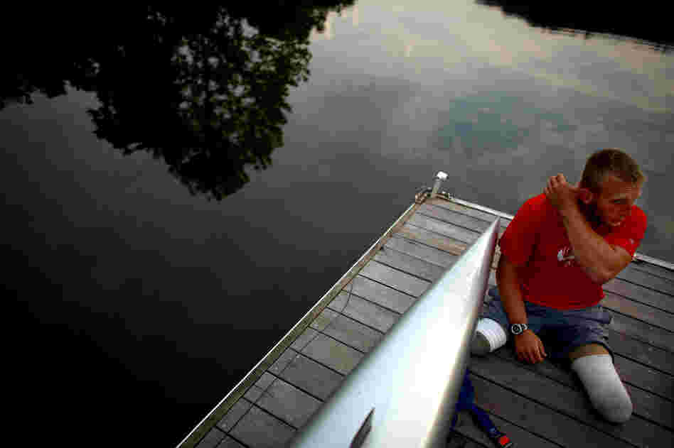 Jones sits on the dock at the Rivanna Reservoir before putting his boat in the water. The Paralympic movement began half a century ago when disabled vets from World War II started looking for a way to continue active lifestyles.
