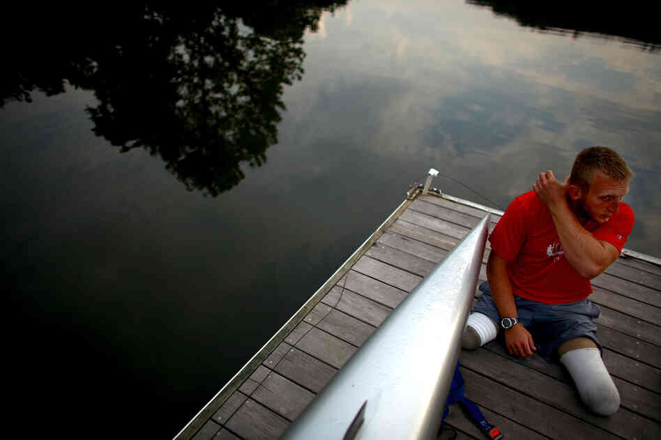 Jones sits on the dock at the Rivanna Reservoir before putting his boat in the water. The Paralympic movement began half a century ago when disabled vets from World War II started looking for a way to continue active lifestyles.