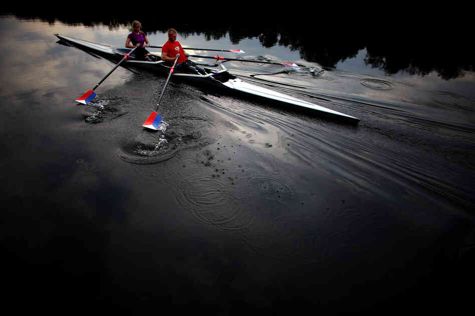 The teammates use a specially adapted rowing shell that is rigged with attachments so they can row comfortably, and slip in and out of the boat on their own.