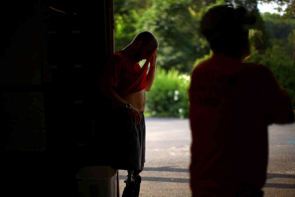 Jones wipes sweat from his head after a morning workout with Masters. Organizers of the games say the new vets raise the caliber of the competition; veterans say Paralympic sports provide inspiration and therapy for young, catastrophically injured soldiers.
