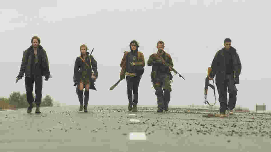 Trekking through a post-apocalyptic world in The Day, haggard survivors Adam (Shawn Ashmore), Mary (Ashley Bell), Shannon (Shannyn Sossamon), Rick (Dominic Monaghan) and Henson (Cory Hardrict) come upon a farmhouse that may provide much needed shelter and supplies — as well as hidden dangers. Trekking through a post-apocalyptic world in The Day, haggard survivors Adam (Shawn Ashmore), Mary (Ashley Bell), Shannon (Shannyn Sossamon), Rick (Dominic Monaghan) and Henson (Cory Hardrict) come upon a farmhouse that may provide much needed shelter and supplies — as well as hidden dangers.