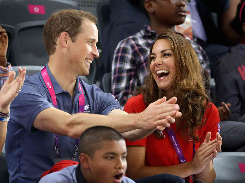 Prince William, Duke of Cambridge and Catherine, Duchess of Cambridge share a joke as they clap whilst watching the track cycling on day 1 of the London 2012 Paralympic Games. (I left in the part of the original caption that says "whilst," because, come on.) Prince William, Duke of Cambridge and Catherine, Duchess of Cambridge share a joke as they clap whilst watching the track cycling on day 1 of the London 2012 Paralympic Games. (I left in the part of the original caption that says "whilst," because, come on.)